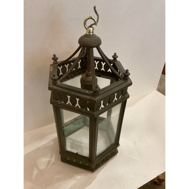 This listing features a Gothic Revival-style antique brass pendant or lantern. This pendant has beautiful details like cut...