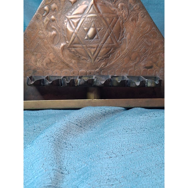 This exceptional Chanukah (Chanukiah) lamp is a significant example of Maghrebi Jewish craftsmanship, hailing from the...