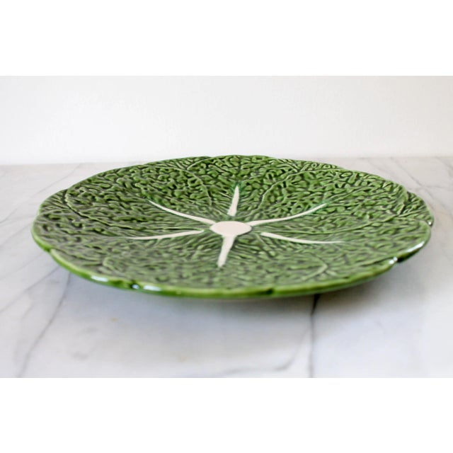 Vintage Olfaire majolica green cabbage plate with scalloped edge. Made in Portugal. Minor age wear. No chips.