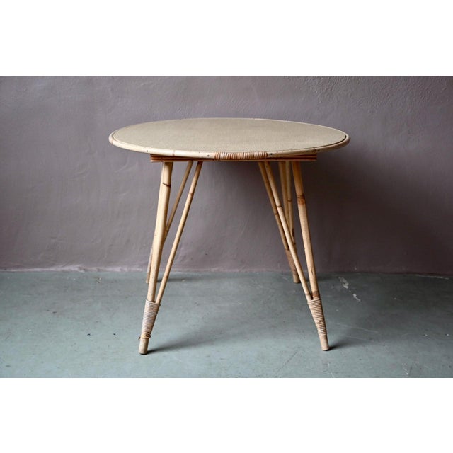 This tall rattan table or side table would be perfectly at home in a small bohemian kitchen or a conservatory. The...