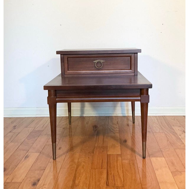 Italian Neoclassical Tuscan style, accent step end table by American of Martinsville. This table features angular walnut...