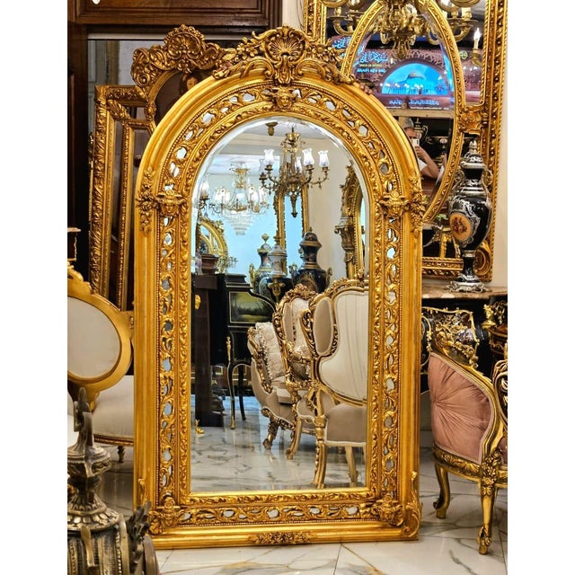 Make a stunning statement with this grand French Baroque-style wall mirror, featuring an exceptionally ornate frame...