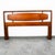 Handsome and timeless mid century Modern Queen size headboard crafted from wood with a rich finish. Neat cut out design...
