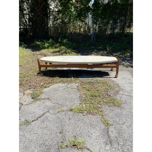 Mid Century Modern Surfboard Coffee Table in Terrazzo Marble and Travertine + Wood in the Style of Harvey Probber. A...