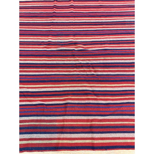 this mid-20th-century Turkish Decorative textile is a beautiful testament to Anatolian tribal flat-weaving craftsmanship....