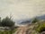 Original watercolor on textured paper depicting a winding country road through rocky green terrain toward distant blue-...