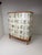 1950’s curved front Swedish cabinet later papered with illustrations by C.A. Lindman book Nordens Flora. Cabinet consists...