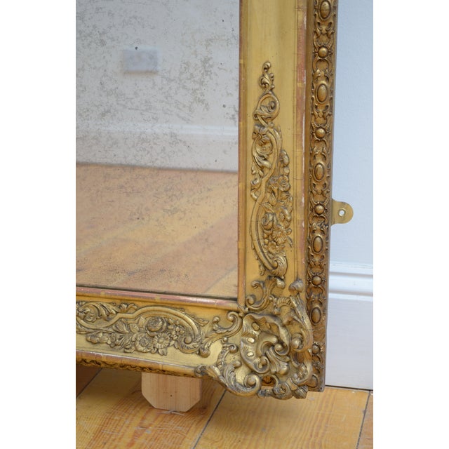 A superb 19th-century french chateau giltwood wall mirror featuring an exceptionally versatile form that can be displayed...