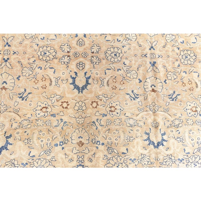 This authentic 19th-century Persian Tabriz rug, exemplifies the exquisite craftsmanship of Tabriz weavers. Its camel-...