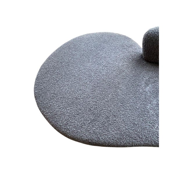 An iconic Serpentine Sofa by Vladimir Kagan, showcasing the designer’s signature curvilinear form and sculptural presence....