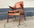 Solid teak armchair or lounge chair recently upholstered in tanned brown aniline leather. The 'nails' armrests are made...
