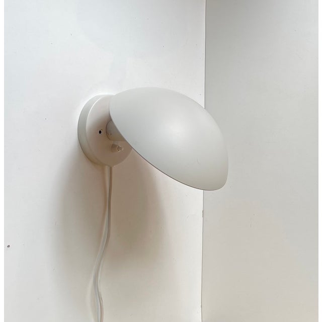 White PH Hat wall lamp designed by Poul Henningsen in the late 1970s. This particular example was manufactured by Louis...