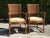 Exceptional vintage pair of barrel-back rattan dining armchairs with beautifully crafted curved frames and intricately...