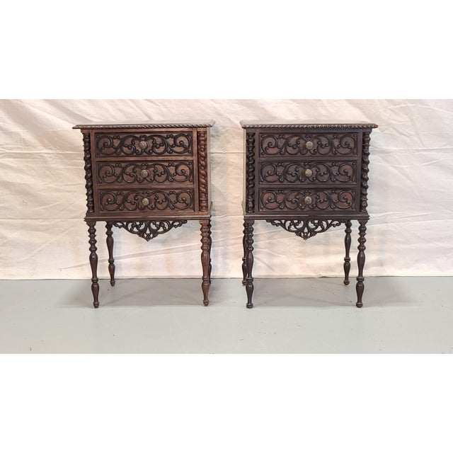 This beautiful pair of solid wood French nightstands features detailed hand-carvings and turned columns. Each has three...