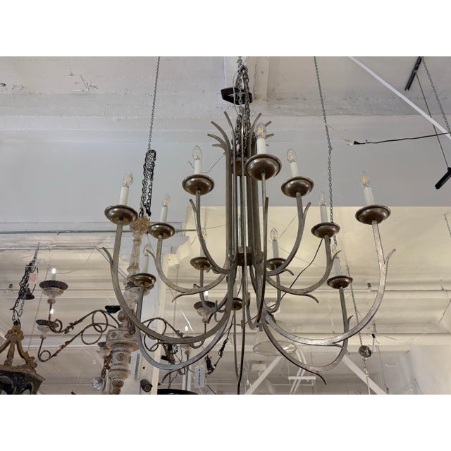 Design Plus Gallery presents a Keuning #6037 Large Chandelier by Dessin Fournir. Hand forged iron in a soft champagne...