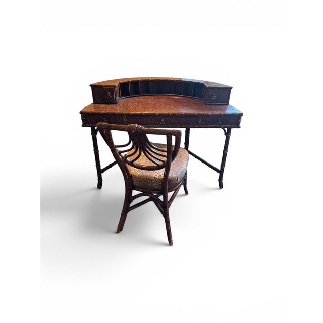A striking authentic Ficks Reed vintage Regency-style faux bamboo and rattan desk featuring an elegant tortoise lacquer...