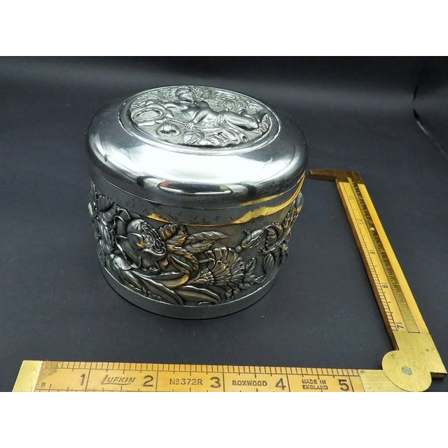 This marvelous antique Art Nouveau style jewelry box is created in gorgeous sterling silver with a top lid panel of a...