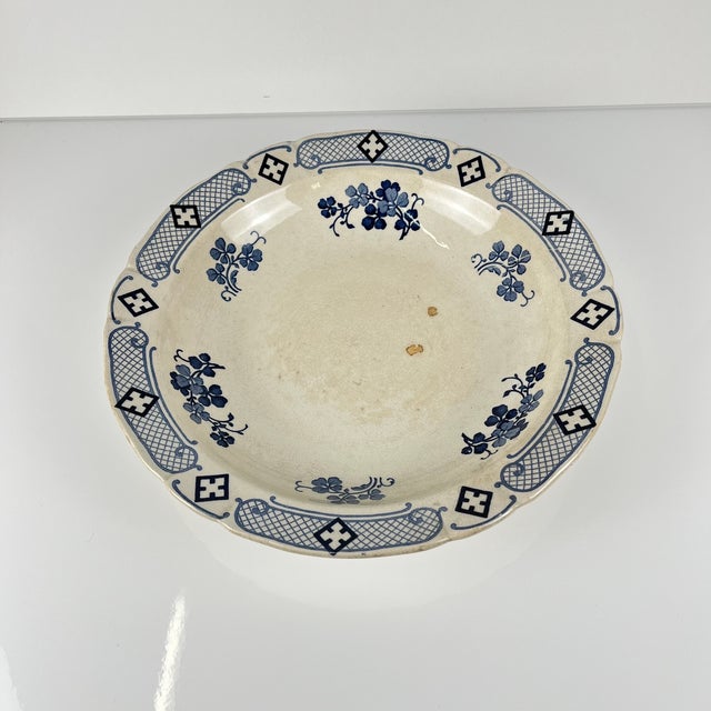 Low Terre de Fer salad bowl by KG Lunéville, "Jane" model, blue, 1890-1915 Dimensions: Diameter: 28.5 cm Height: 5 cm This...