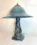 Up for sale is a high quality original K Dahl Glass Studios figural bronze and glass nautical table lamp. The footed base...