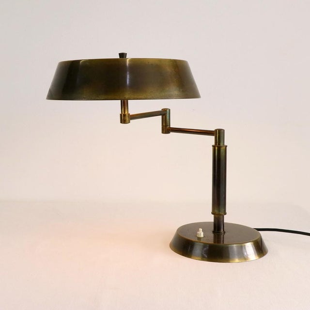 This refined 1940s table lamp perfectly embodies the luxurious industrial aesthetic of the midcentury period. Crafted...