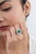 This vintage-style cocktail ring features a 4.1 ct emerald set in 14K white gold. The center stone measures 10.8 × 9.2 mm,...