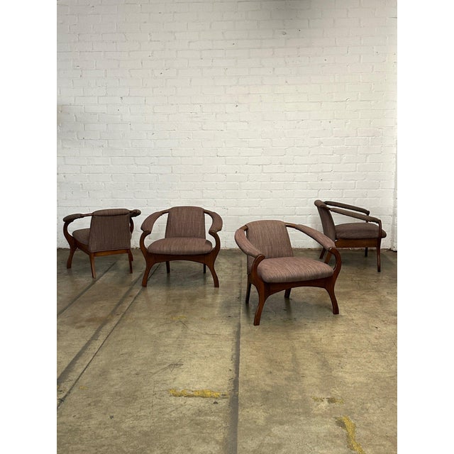 W30 D29 H27 SW21.5 SD20 SH16 AH22.5 Vintage solid walnut Adrian Pearsall style horshoe lounge chairs. Each unit features...