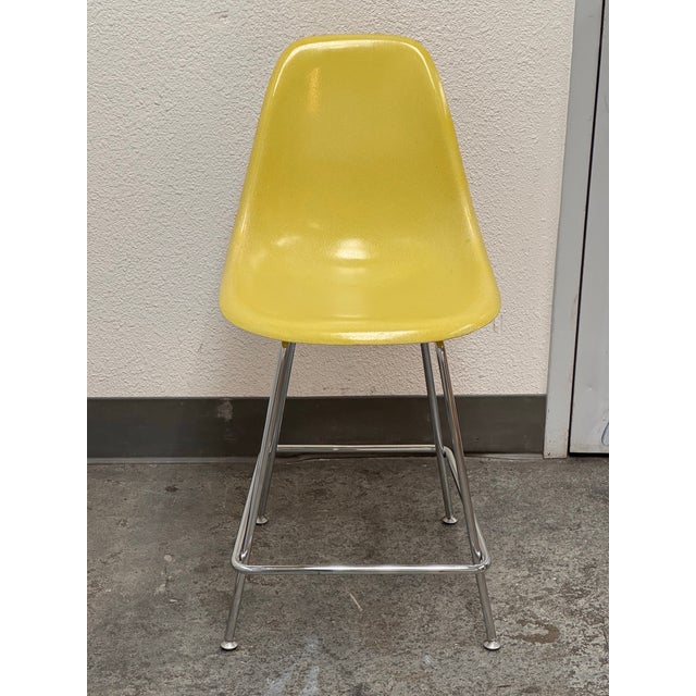 Design Plus Gallery presents a Fiberglass Yellow Shell Counter Stool. This iconic midcentury design pairs a molded yellow...