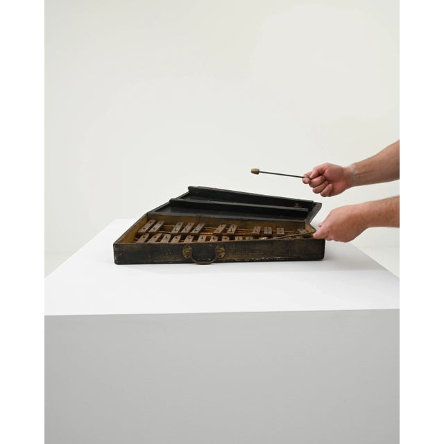 Discover the enchanting notes of the past with this Early 20th Century French Wooden Xylophone, a musical treasure wrapped...