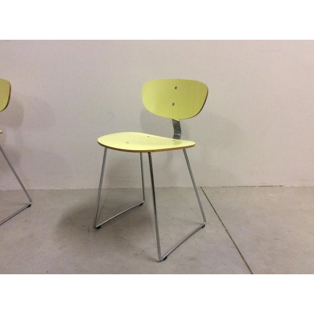 Set of 4 chairs, 1950s, structure in plywood curved ant light yellow and steel.