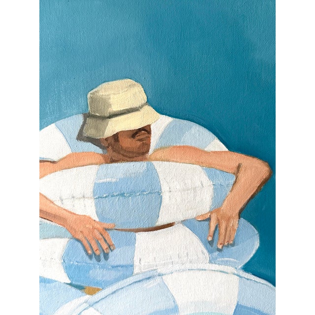 This fun pool painting featuring a man taking a catnap in cool pool waters, positioning the pool floats just so. The image...