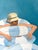 This fun pool painting featuring a man taking a catnap in cool pool waters, positioning the pool floats just so. The image...