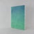This dynamic modern art piece evokes the rhythmic energy of the ocean through a vibrant, layered composition of teal,...