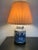 A stunning ginger jar shaped, blue and white, chinoiserie table lamp with a double light fixture. This large lamp displays...