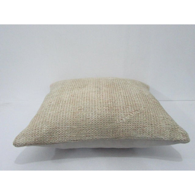 Decorative pillow cover made from a vintage Turkish handknotted rug. Backed with good quality cotton fabric. Pillow...