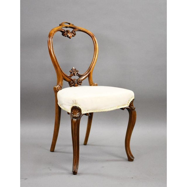 Set of 4 Victorian Walnut Balloon Back Dining Chairs Item Code: LC1463 A decorative set of four Victorian walnut dining...