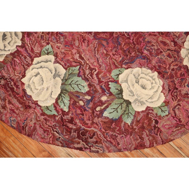 A compelling Mid-20th Century American hooked oval size floral botanical rug Measures: 6'8" x 9'7''.