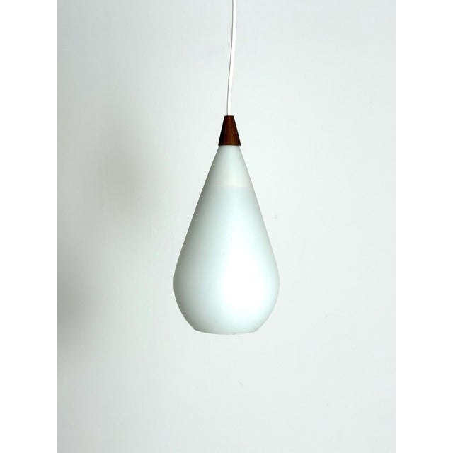 Pendant Light, 1960s–70s A beautiful Danish vintage pendant light from the 1960s–70s, made of white opaline glass with an...