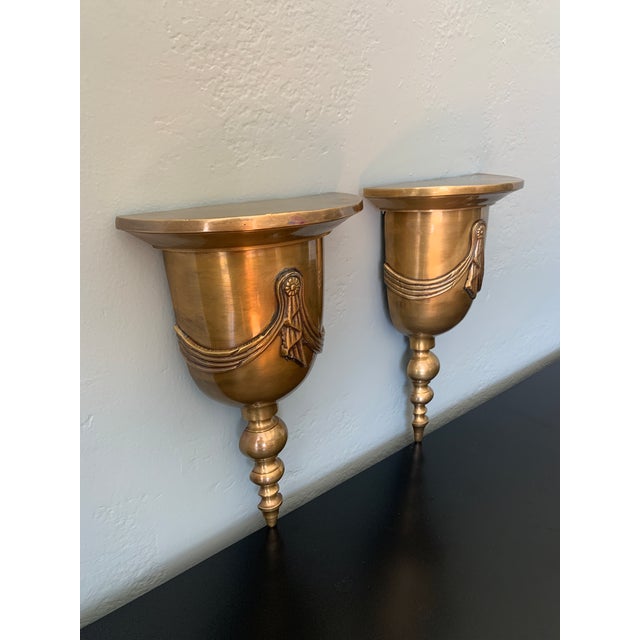 Pair of Solid Antique Brass Wall Brackets with Swags.