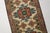 This is a vintage Turkish Oushak rug from the Mid 20th Century. The piece was hand-knotted.
