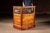Oak barber shop display cabinet featuring a glazed upper showcase with fixed side glass, removable glass display shelf,...