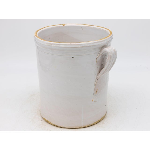 This 19th-century French confit pot features a classic glazed stoneware body with traditional dual handles, both...