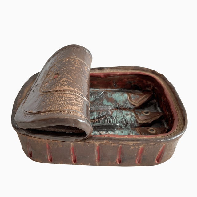 A cheeky and beautifully executed vintage studio art stoneware sardine tin with three sculpted sardines. Modeled after an...