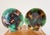 From Wedgwood, a set of two English majolica scallop shell shaped, mottled tortoiseshell glazed plates. Each plate shows a...