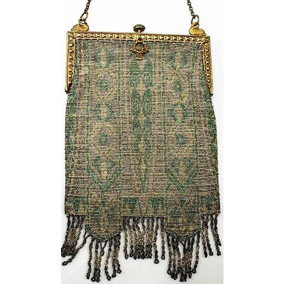 This art deco beaded bag is exquisite! Photos don't show up how the beads glitter! The frame is amazing with swans on...