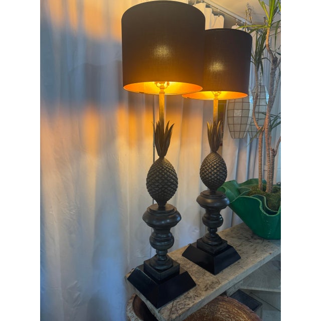 This beautifully restored pair of vintage metal pineapple table lamps exudes neoclassical charm with a striking sculptural...