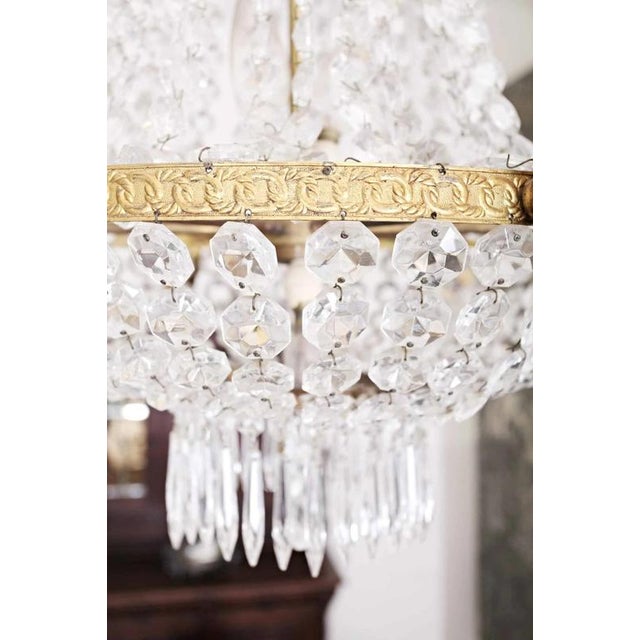 The body of the chandelier is made of cast brass combined with pressed brass. Crystal glass. The chandelier is in the...