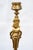 A pair of antique gilded bronze candlesticks, finely chiseled and signed "Barbedienne". The central stem is adorned with...