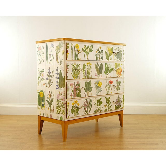 Vintage dresser crafted in pine and birch in Sweden in the 1950s covered with Illustrations `Nordens Flora`by CAM Lindman,...
