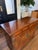 An exceptional Henredon Scene One Collection Slide-top dry bar cabinet, masterfully crafted in richly figured mahogany and...