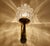 Pair of Vintage sconces from the 1960s with stylised flame shaped crystal glass shades mounted on an brass structure...